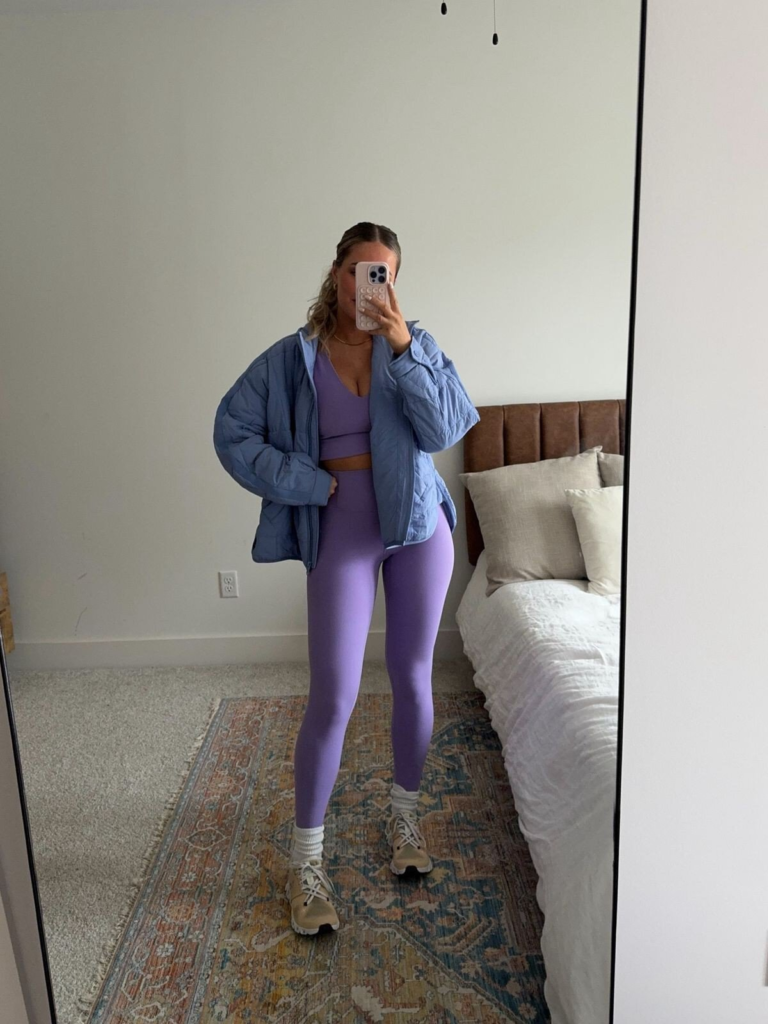 Quilted Puffer Jacket Over Vibrant Leggings
