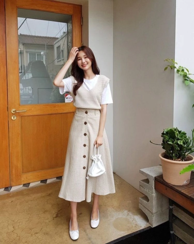 Cream Vest and Button-Front Skirt
