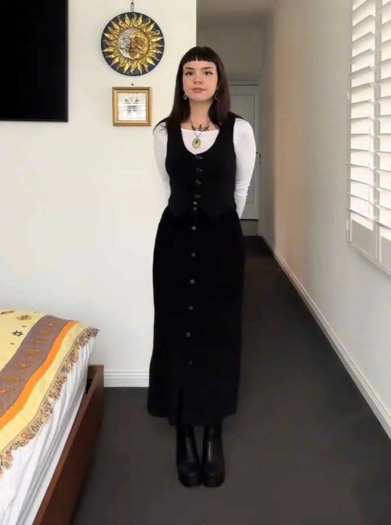 Sleek Black Vest Over White Layered Base
