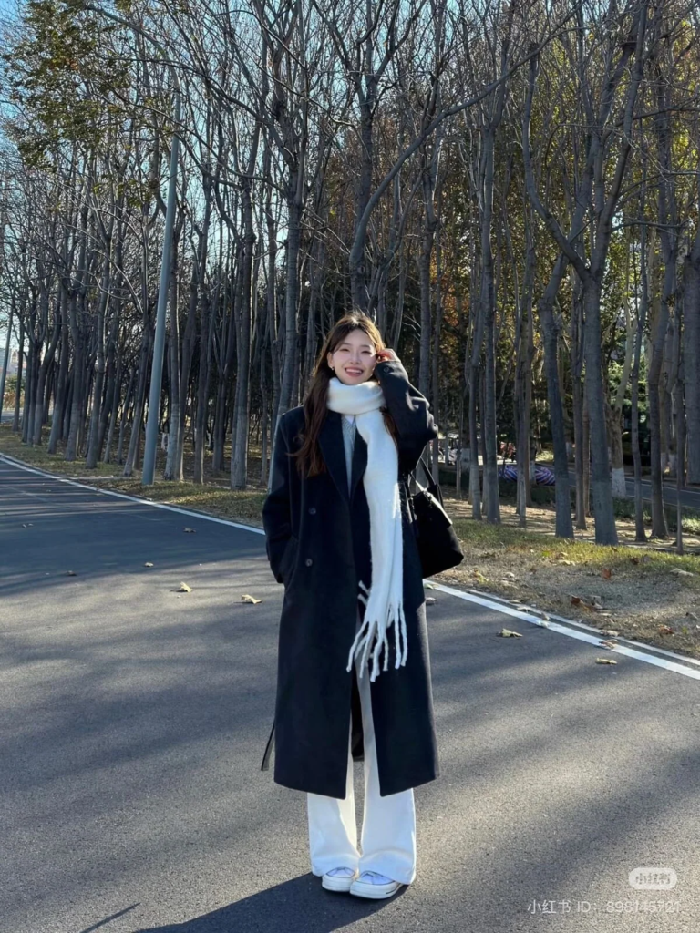 Classic Black Coat with White Scarf
