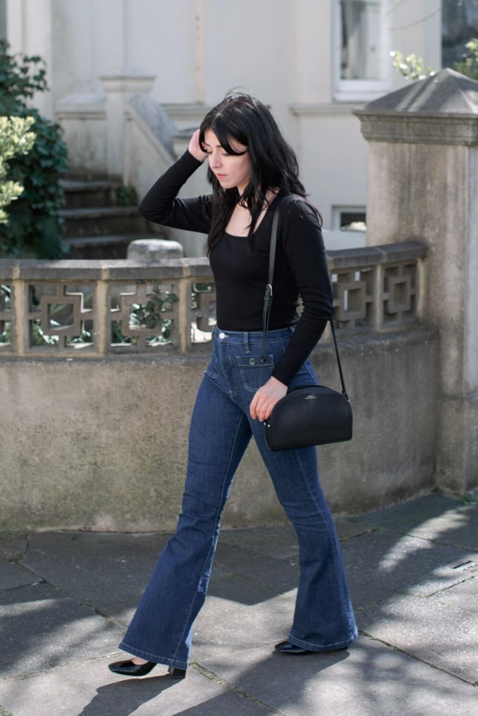 Sleek Black Top with Flared Jeans