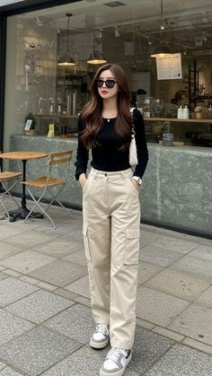 Classic Black Top with Cream Trousers
