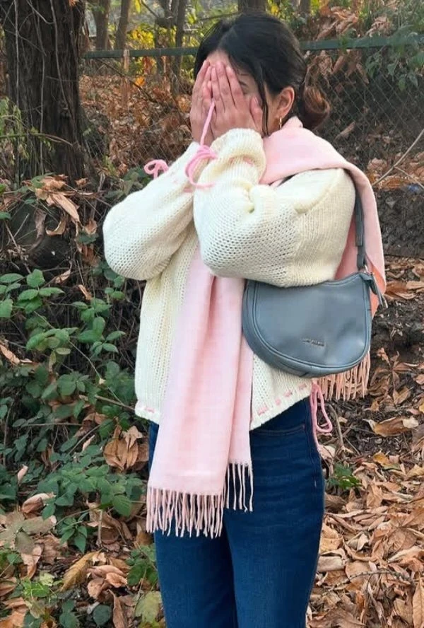Cream Sweater with Pink Scarf Drape
